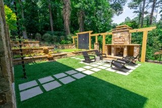 Outdoor patio with seating and greenery