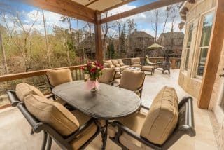 Cozy outdoor seating with floral centerpiece