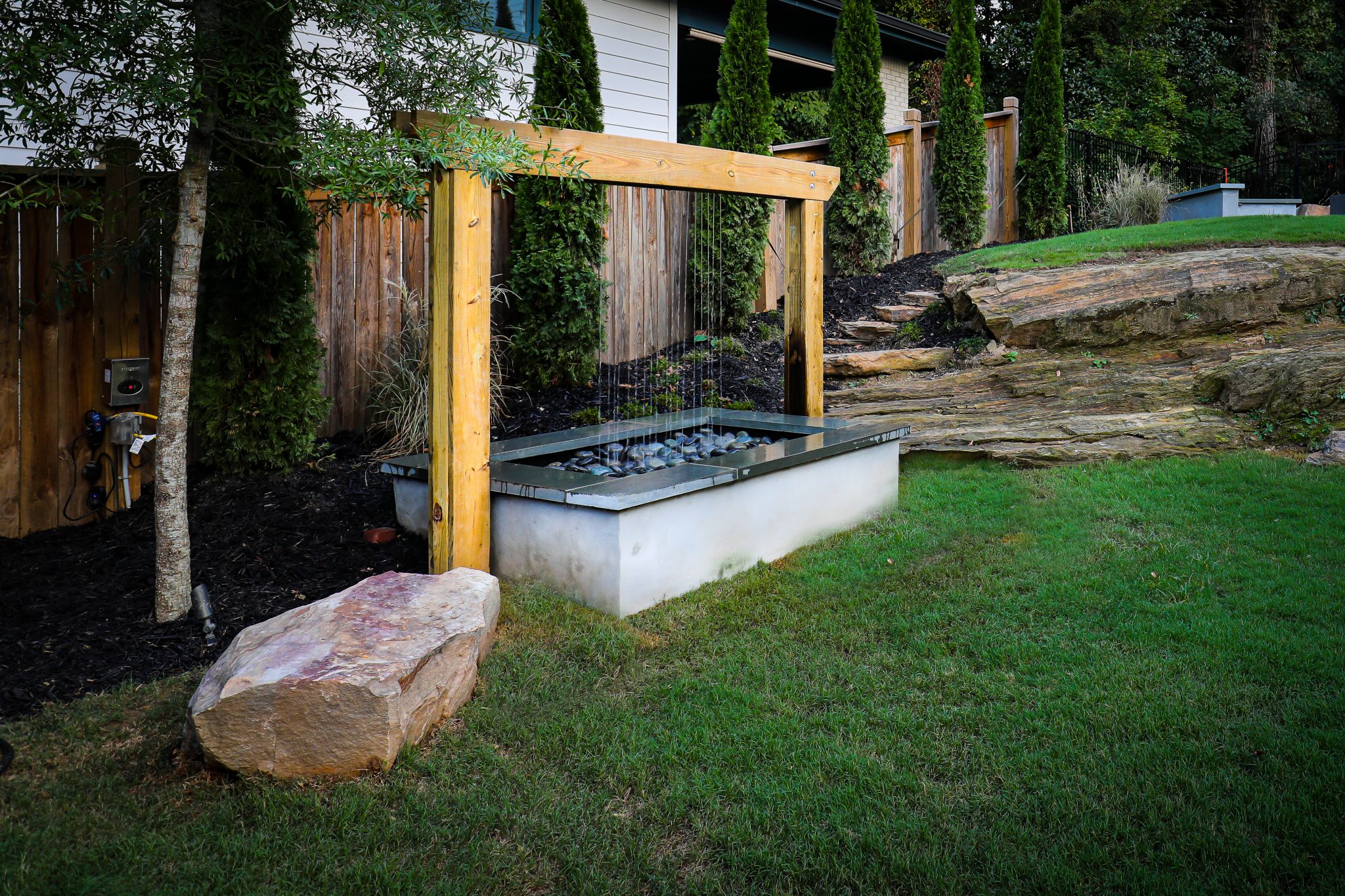 Rain Curtain 1 scaled - Incorporating Outdoor Art & Sculptures into Your Summer Design - outdoor living spaces Atlanta