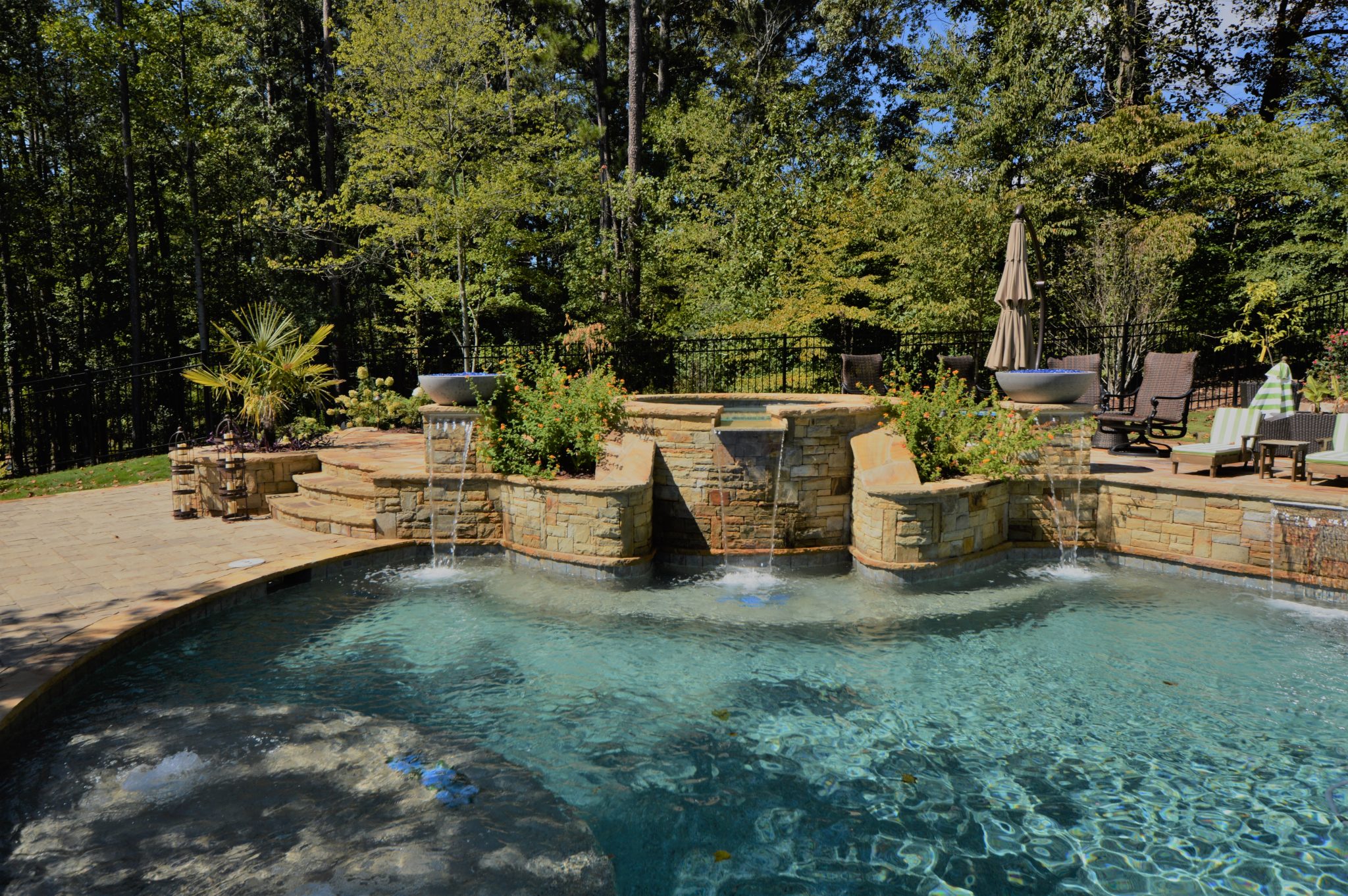 Water Bowls With Pool scaled - The Role of Water Features in Cooling Outdoor Spaces - patio design and installation Atlanta